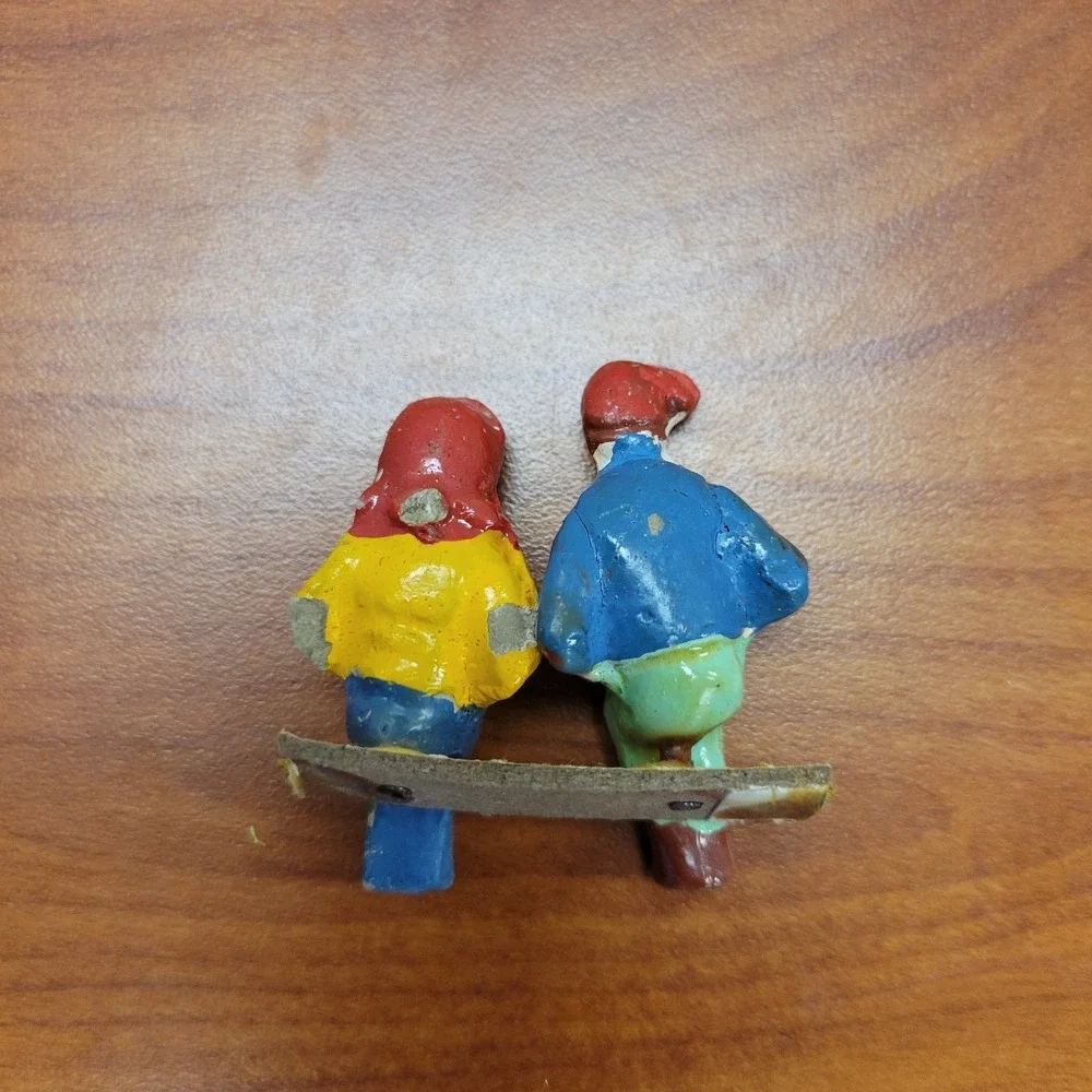 Cast Iron Vintage Hand painted man & woman shelf sitters